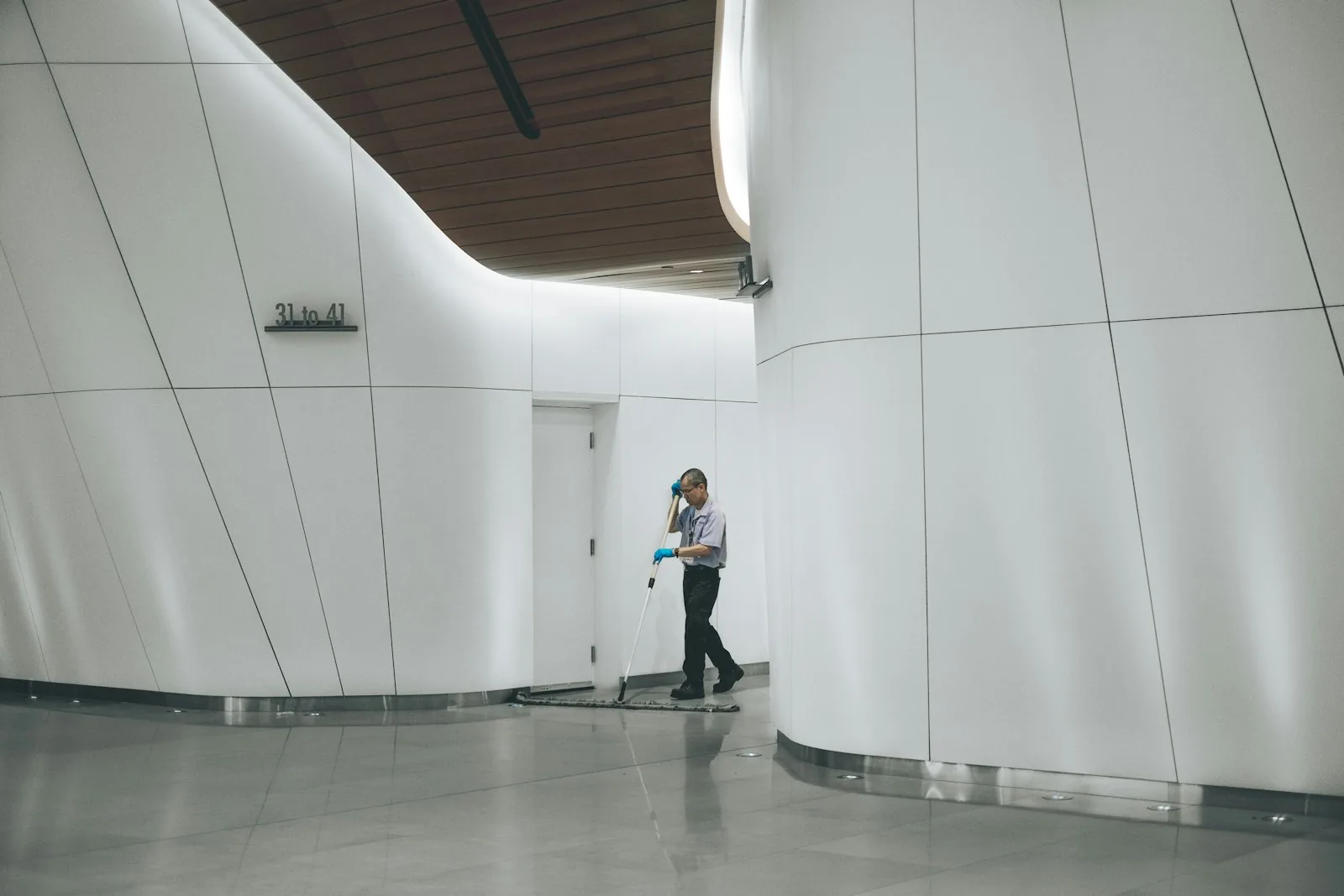 Office and facility cleaning crew with paper products and gloves